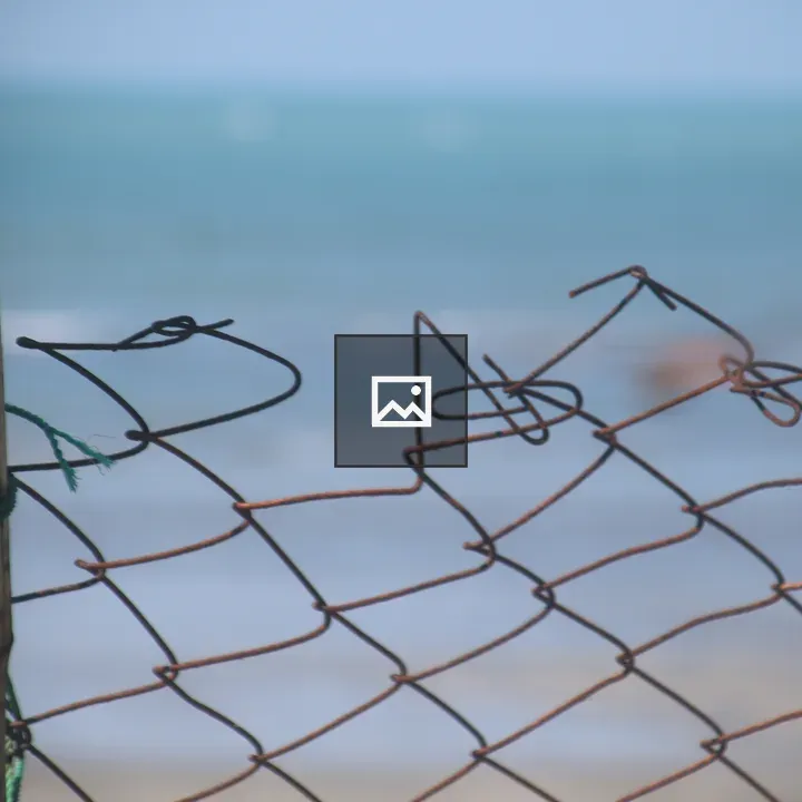 Ragged Top of Chainlink Fence