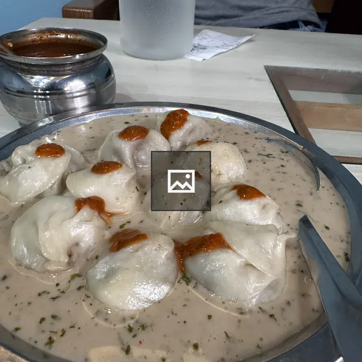 Momo food with creamy sauce