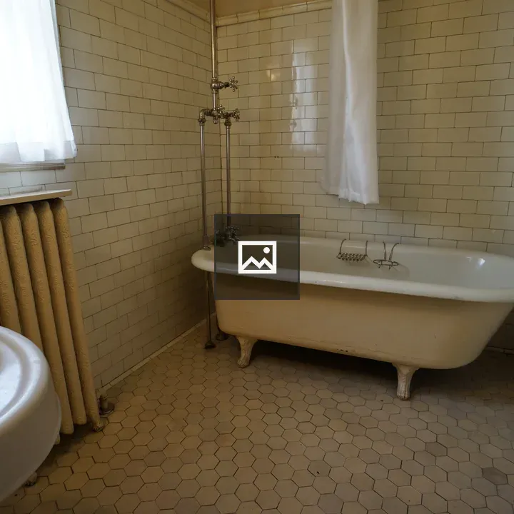 Bathtub in tiled bathroom
