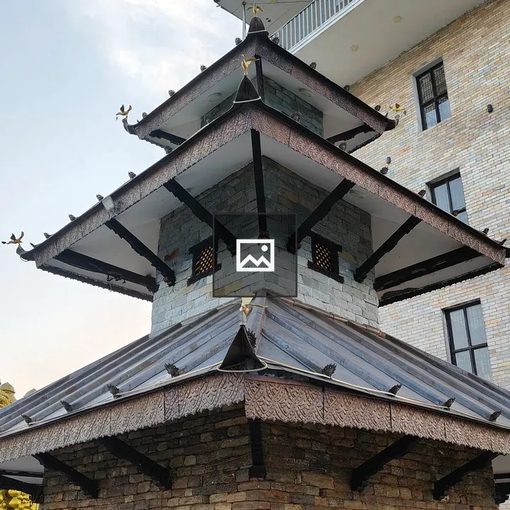 Pagoda-style temple beside brick building