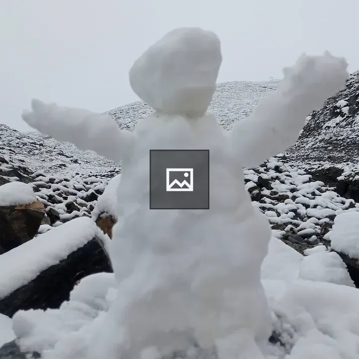 Snow figure on rocky snow