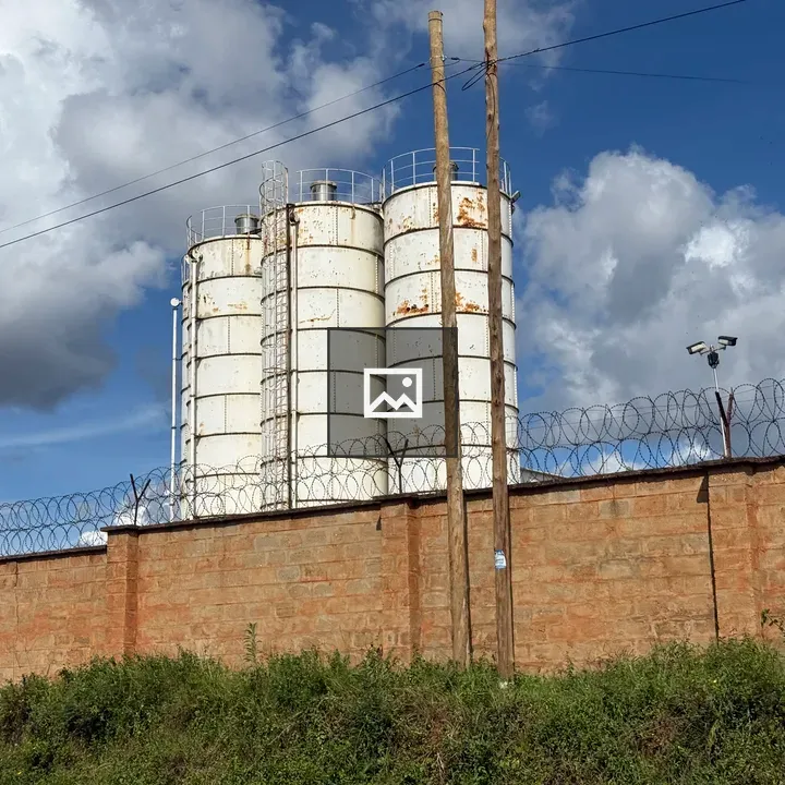 Manufacturing plant behind a fence