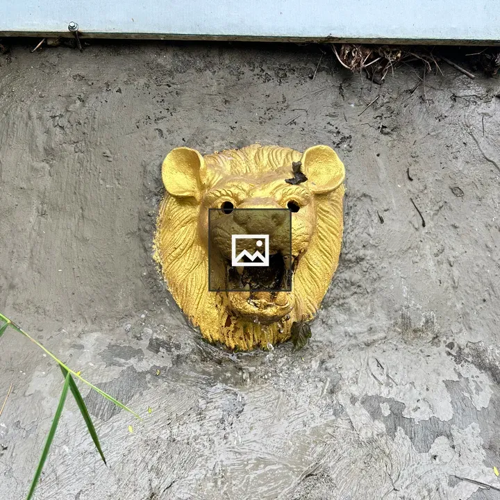 Golden lion head sculpture