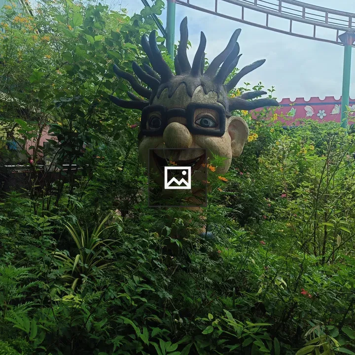 Whimsical sculpture with foliage