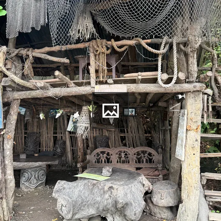 Rustic wooden structure with foliage roof