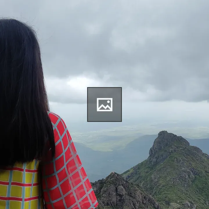 Woman Overlooking Mountain Vista