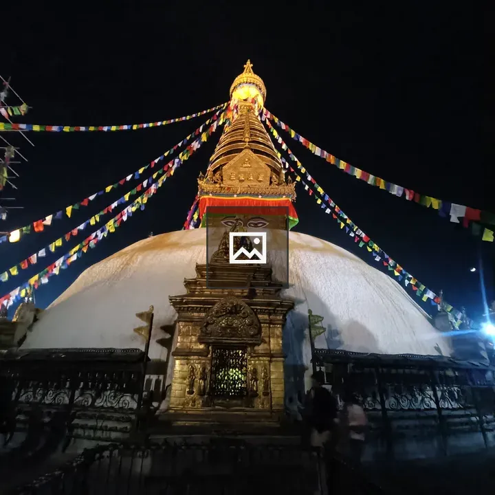 Stupa at Night with Golden Spire
