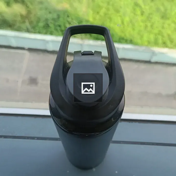 Black water bottle near window