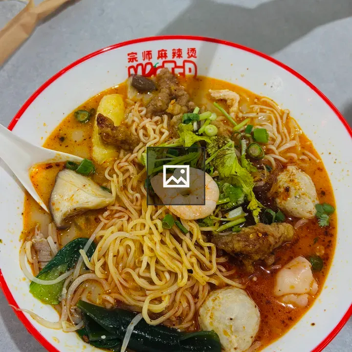 Spicy noodle soup bowl close-up