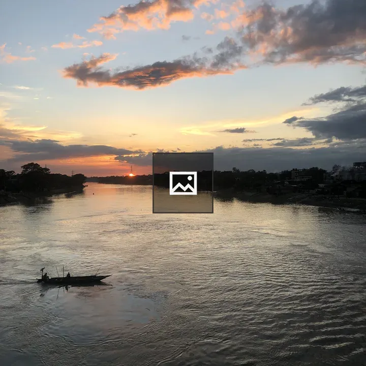 Sunset over Wide River with Boat