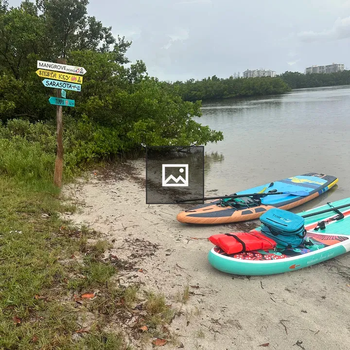 Two paddleboards on the beach