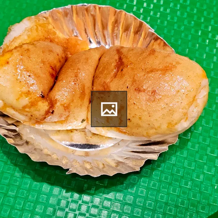 Soft pav stuffed with spicy vada