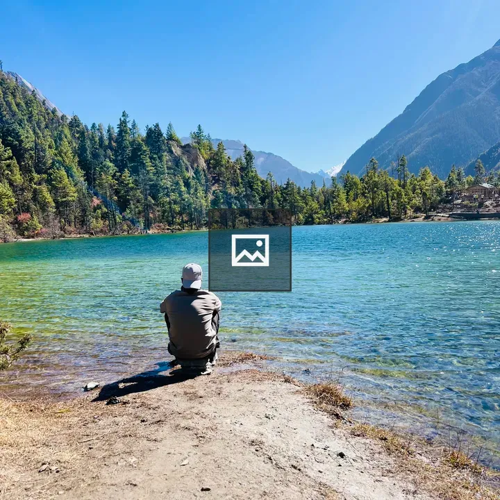 Person by Blue Lake