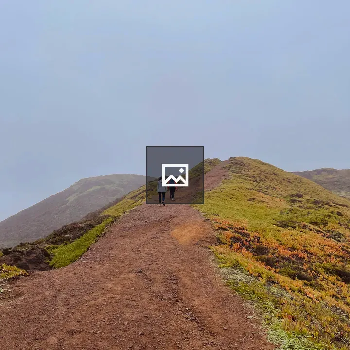 Two hikers on coastal ridge trail