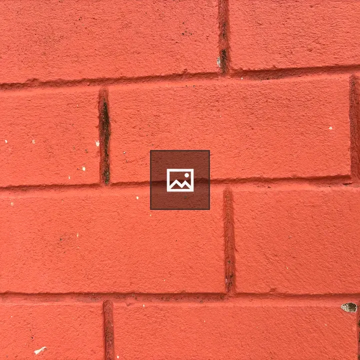 Textured red brick wall