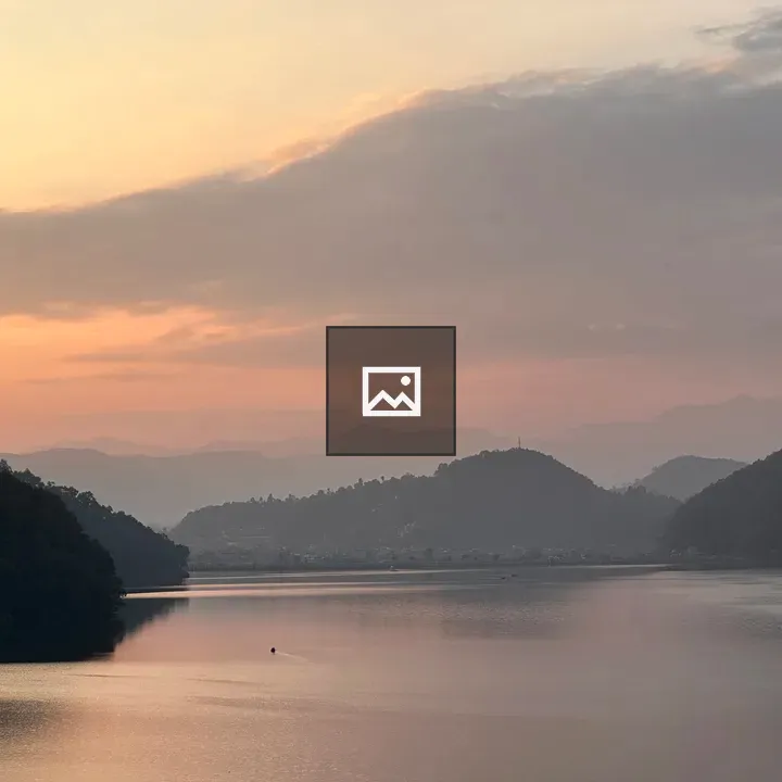Sunrise over mountains and lake