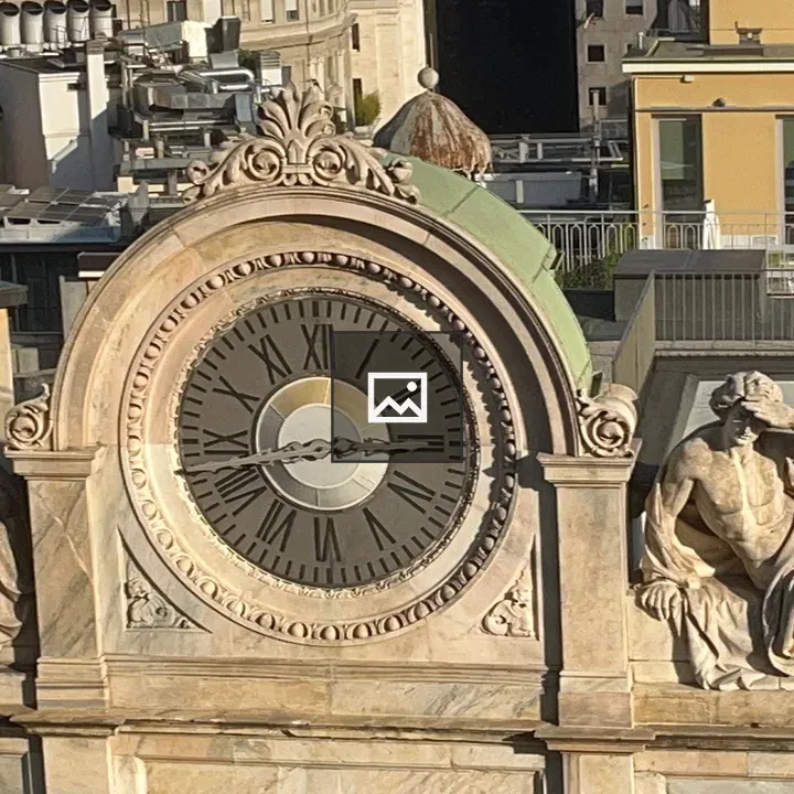 Statuesque clock in Milan