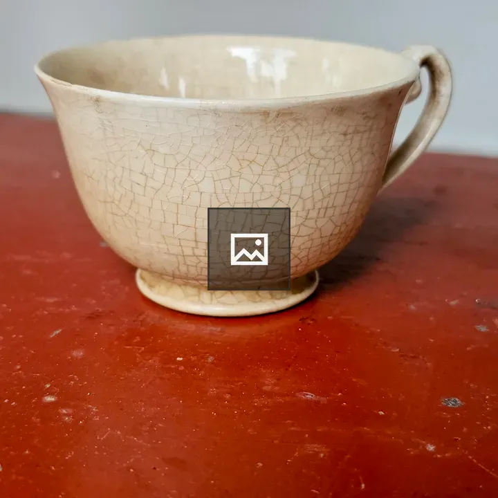 Antique teacup on wooden table