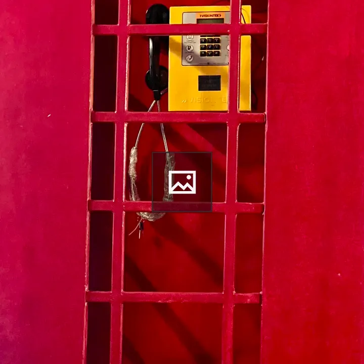 Payphone within Red Grate