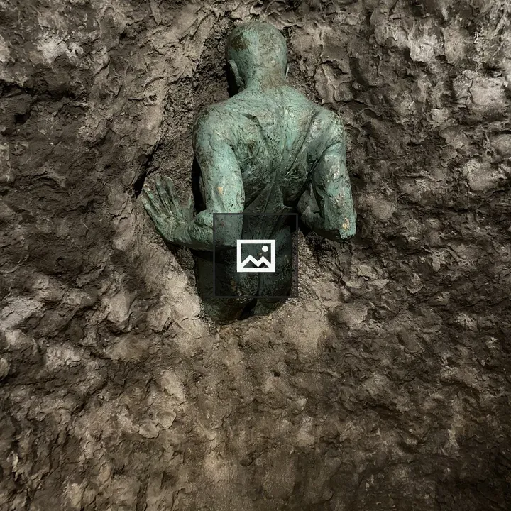 Bronze sculpture crouching figure