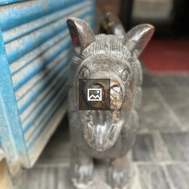 Statue of carved animal figure
