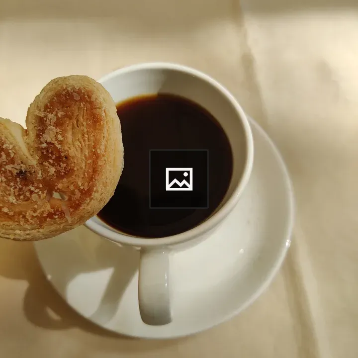 Cup of coffee with a cookie