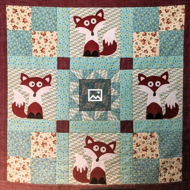 Handsewn quilt with fox panels