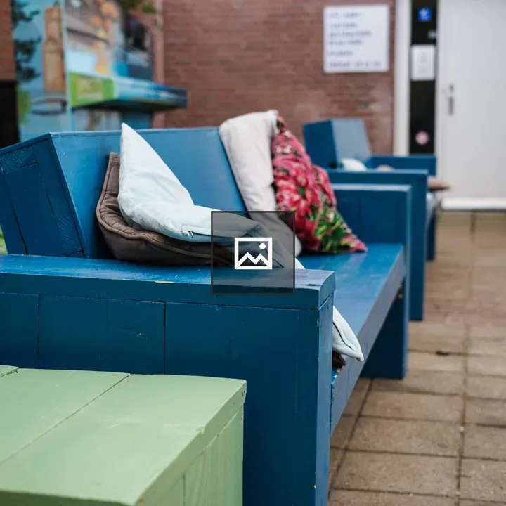 Blue wooden benches with cushions