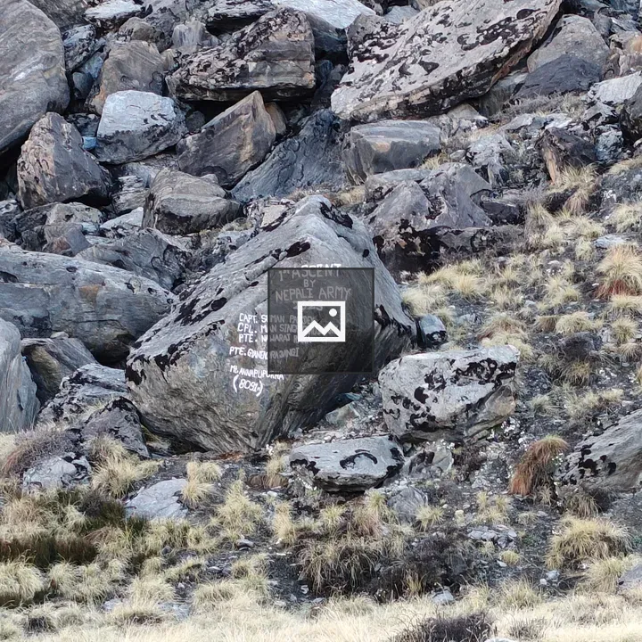 Rocky mountainside boulder with painted text