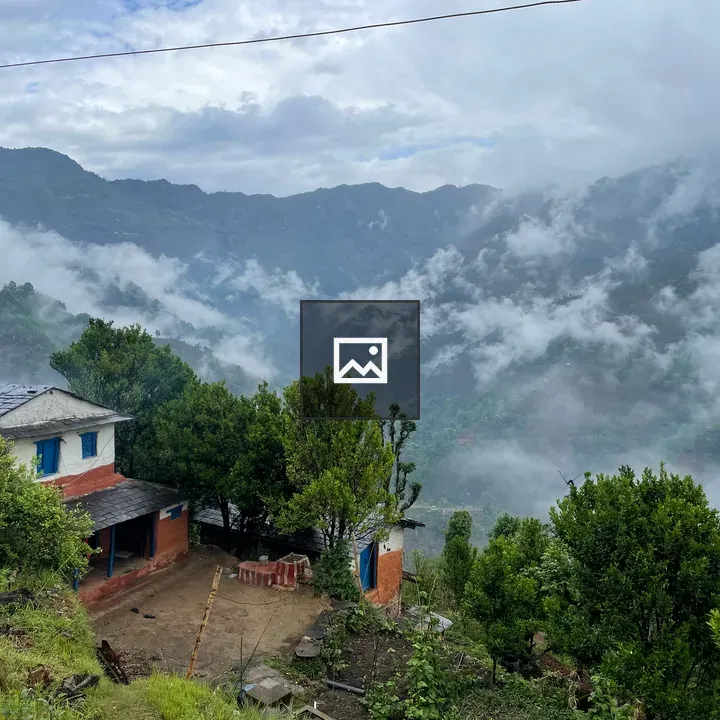 Village house under monsoon clouds