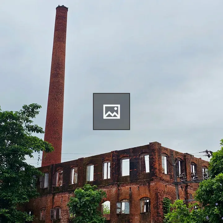 Ruined title factory with brick chimney