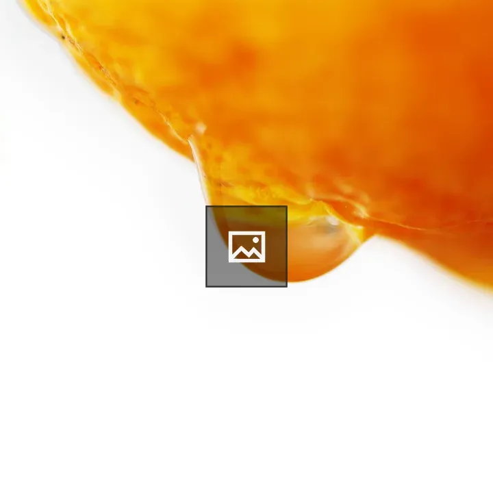 Water droplet on Seville orange