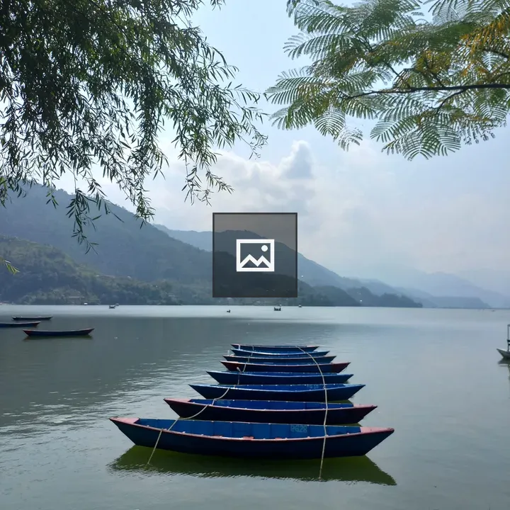 Blue boats on calm lake