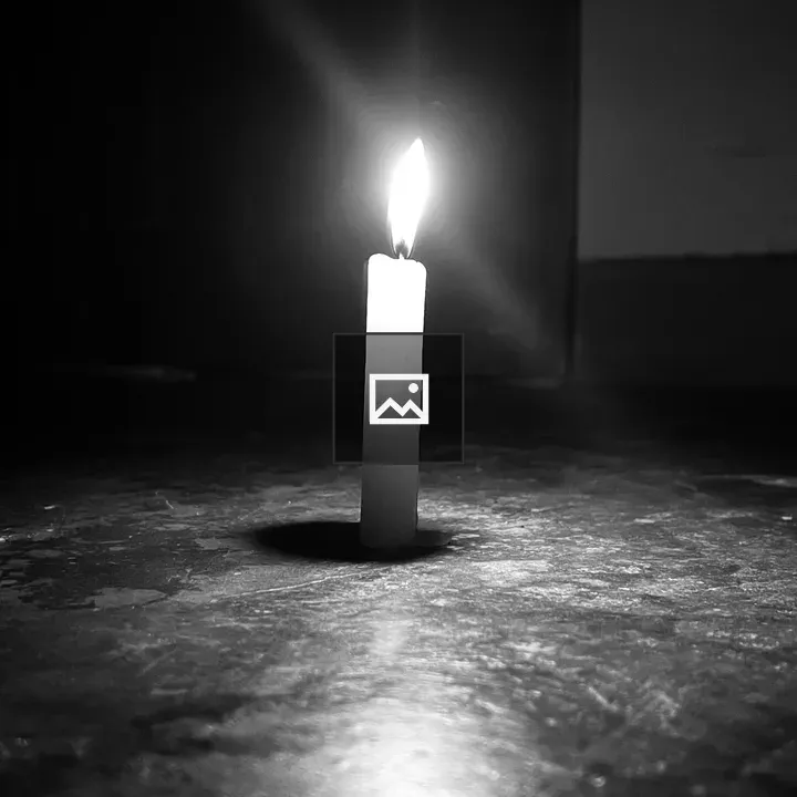 Candle in a Dark Setting