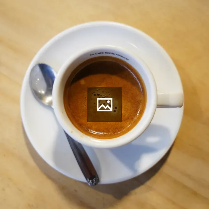 Cup of coffee on wooden table