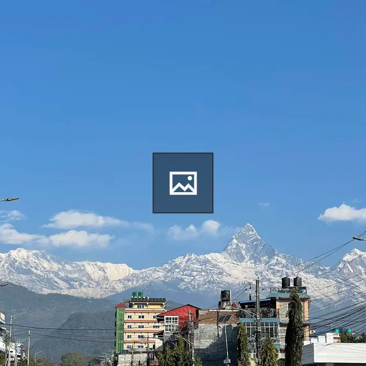 City skyline with mountain backdrop