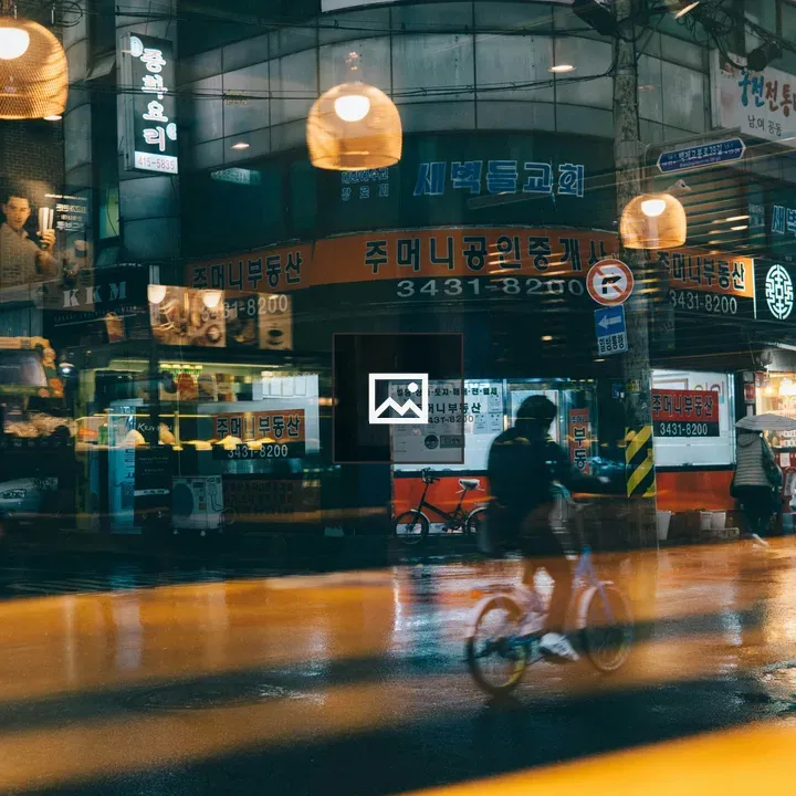 Cyclists in the Rain at Night