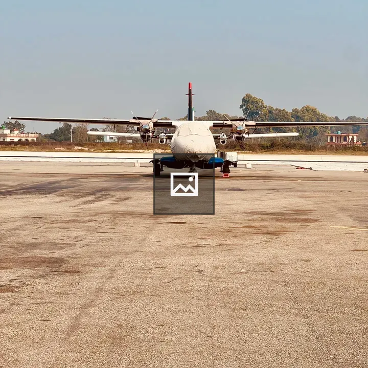 Symmetrical white twin-turboprop aircraft
