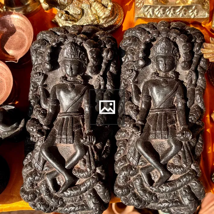 Seated stone sculptures