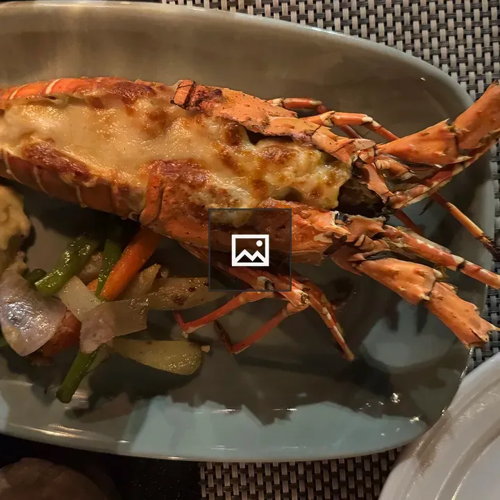 Grilled prawn with cheese on plate