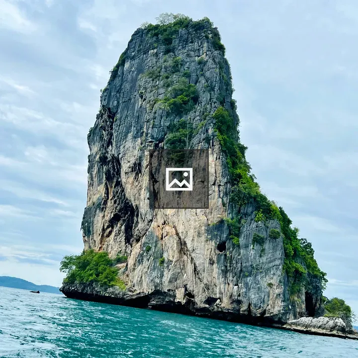 Rocky Green Cliff Over Turquoise Sea