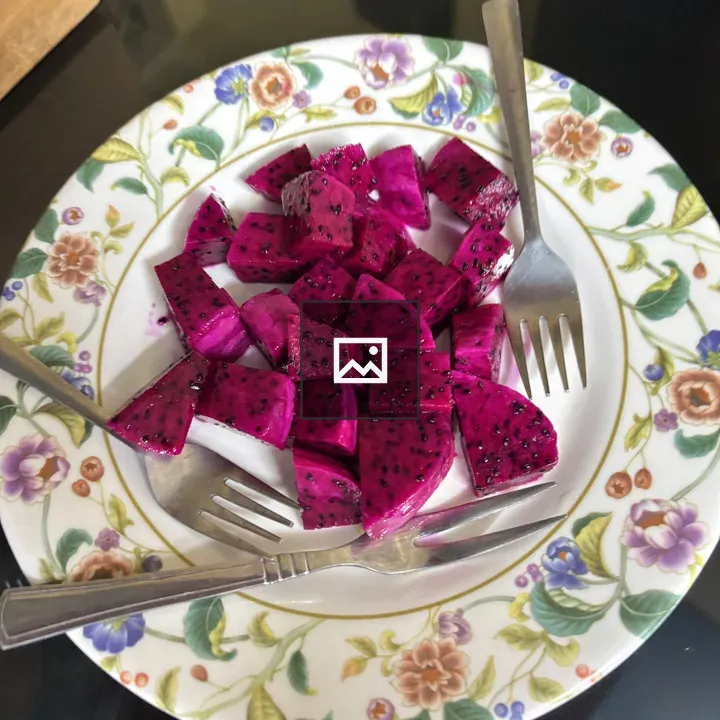 Pink dragon fruit cubes on plate