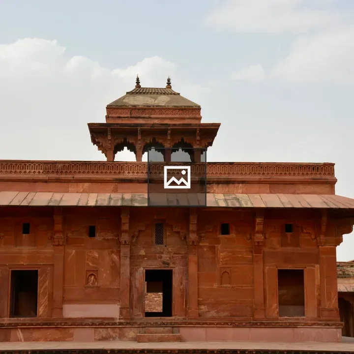 Symmetrical sandstone building with chhatri