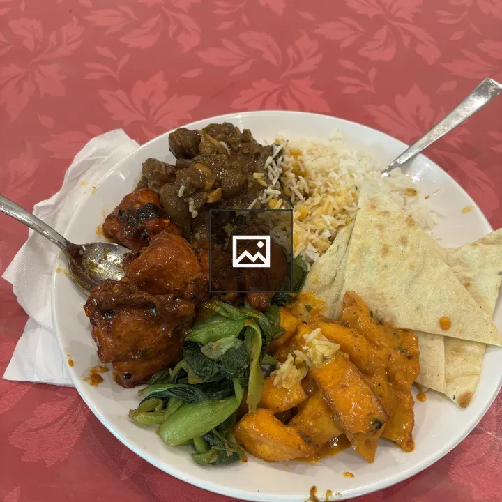 Plate of grilled chicken and greens