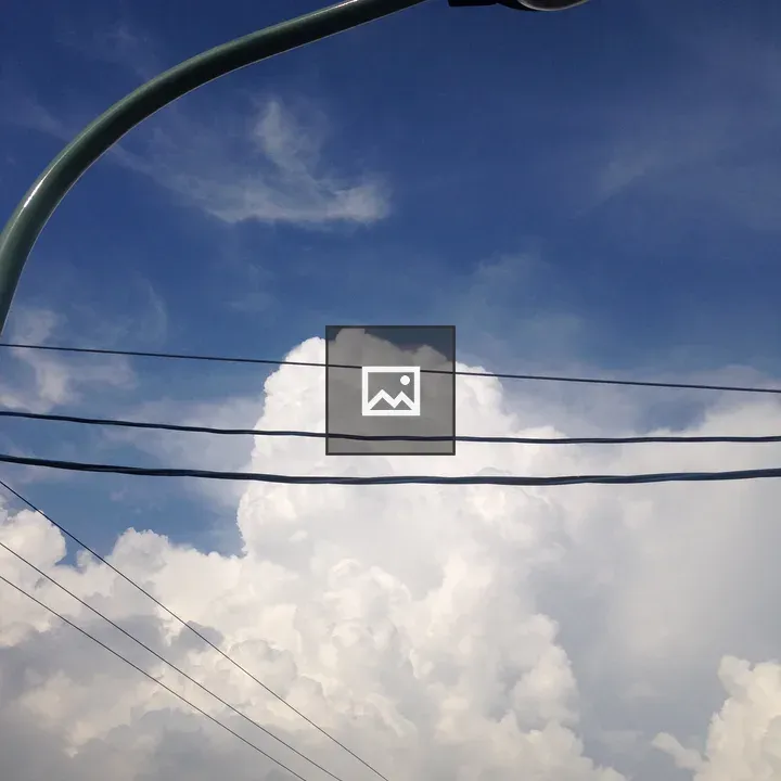 Clouds with street lamp and wires