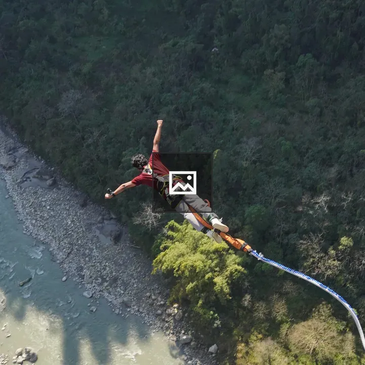Bungee jumper over river