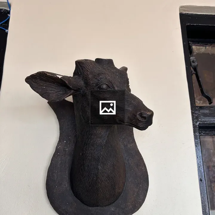 Mounted deer head sculpture