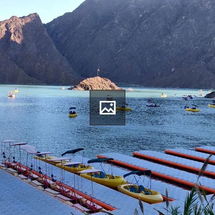 Lake scene with boats and dock