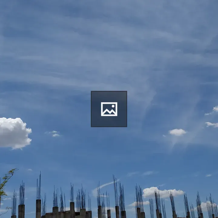 Cloud over rooftop and tree