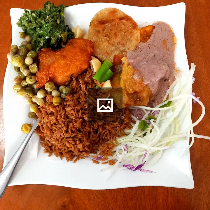 Ugandan food dish with matooke and chicken